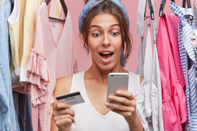An image representing a woman using an eco-friendly app to shop.