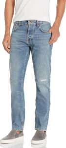 Nudie Jeans Grim Tim men’s slim straight-fit jeans in light blue wash, made with organic cotton and subtle thigh distressing.